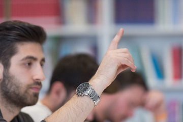 Image showing group of students  raise hands up