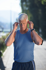 Image showing portrait of handsome senior jogging man