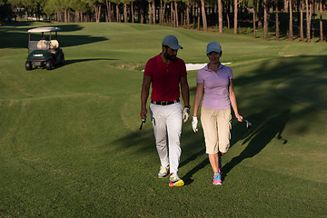 Image showing couple walking on golf course