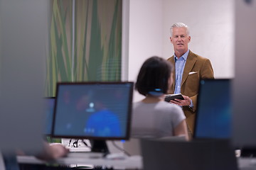 Image showing teacher and students in computer lab classroom