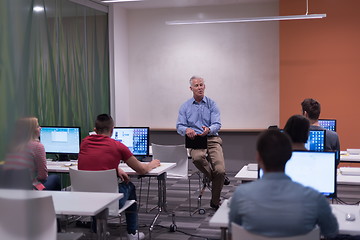 Image showing teacher and students in computer lab classroom