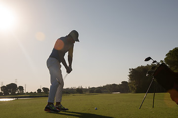 Image showing golf player hitting shot