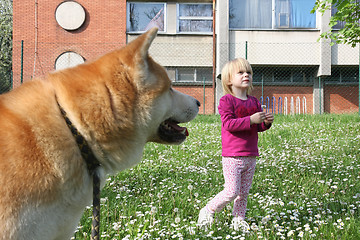 Image showing Young girl and dog