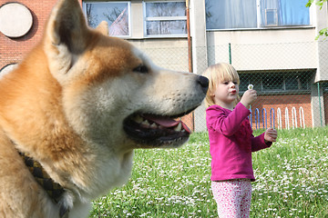 Image showing Young girl and dog