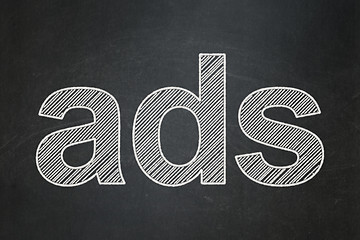 Image showing Advertising concept: Ads on chalkboard background