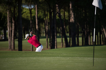 Image showing golfer hitting a sand bunker shot