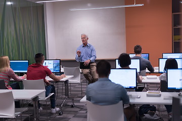 Image showing teacher and students in computer lab classroom