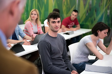 Image showing teacher with a group of students in classroom