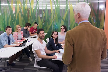 Image showing teacher with a group of students in classroom