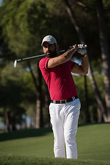 Image showing golfer hitting a sand bunker shot