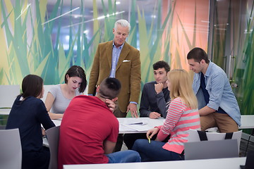 Image showing teacher with a group of students in classroom