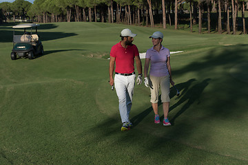 Image showing couple walking on golf course