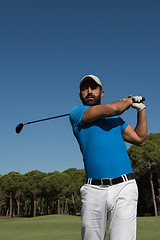 Image showing golf player hitting shot