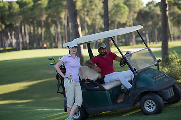 Image showing couple in buggy on golf course