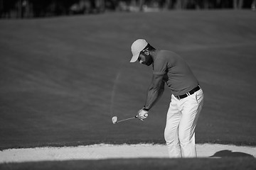 Image showing golfer hitting a sand bunker shot