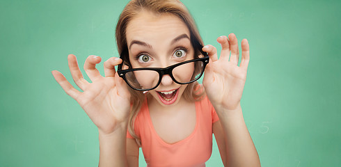 Image showing happy young woman or teenage girl in eyeglasses