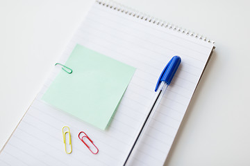 Image showing close up of notebook with pen and bank paper