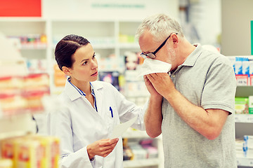 Image showing pharmacist and senior man with flu at pharmacy