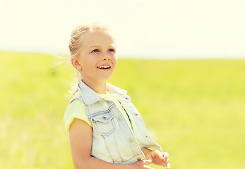 Image showing happy little girl outdoors at summer