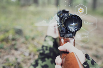 Image showing close up of soldier or sniper with gun in forest