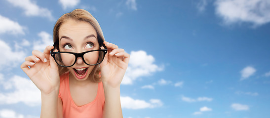 Image showing happy young woman or teenage girl in eyeglasses