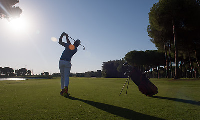 Image showing golf player hitting shot