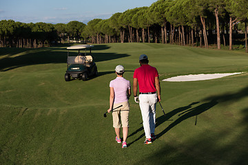 Image showing couple walking on golf course