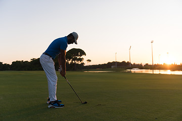 Image showing golfer hitting long shot