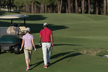 Image showing couple walking on golf course