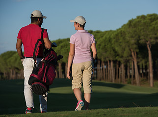 Image showing couple walking on golf course