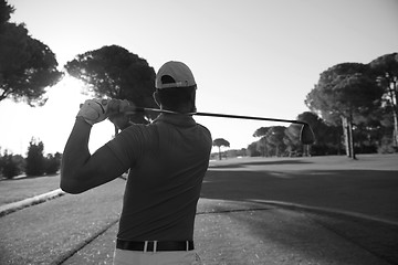 Image showing golf player hitting shot