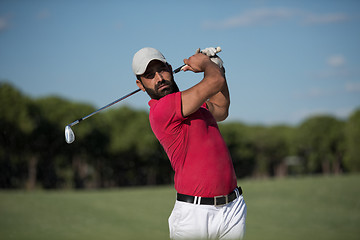 Image showing golfer hitting a sand bunker shot