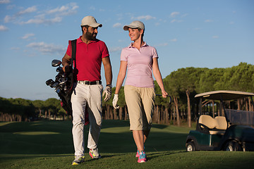 Image showing couple walking on golf course