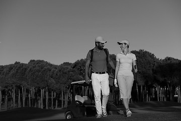 Image showing couple walking on golf course