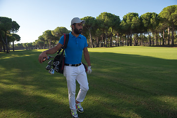 Image showing golf player walking