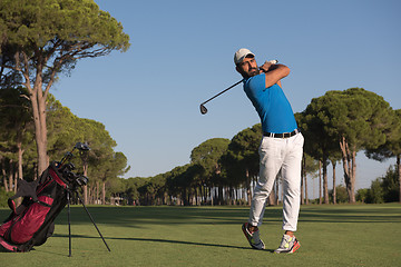 Image showing golf player hitting shot