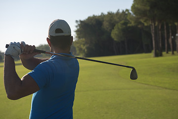 Image showing golf player hitting shot