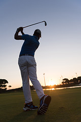 Image showing golfer hitting long shot