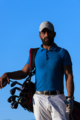 Image showing golfer  portrait at golf course on sunset