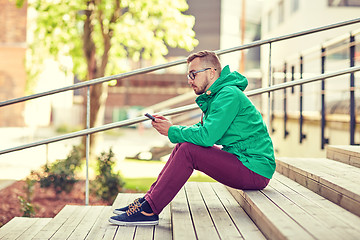 Image showing young hipster man with smartphone in city