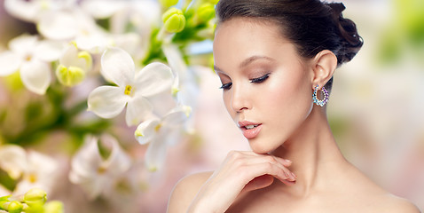 Image showing close up of beautiful woman face with earring