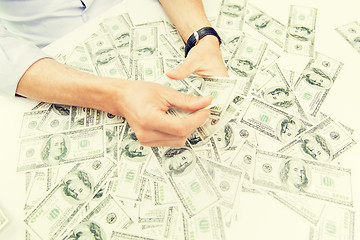 Image showing close up of male businessman hands with money