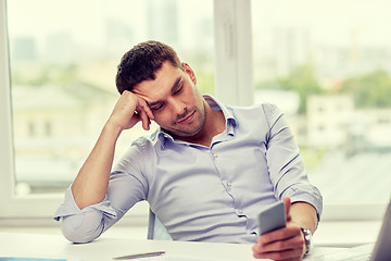 Image showing  businessman with smartphone  at office 