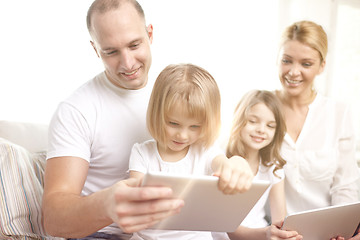 Image showing happy family with tablet pc computers at home