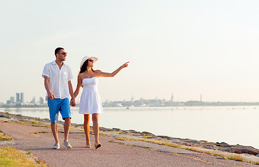 Image showing smiling couple walking outdoors