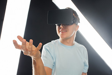 Image showing happy man in virtual reality headset or 3d glasses