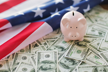 Image showing close up of american flag, piggy bank and money