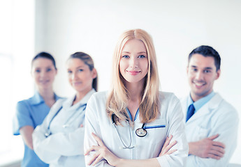 Image showing female doctor in front of medical group
