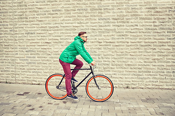 Image showing young hipster man riding fixed gear bike