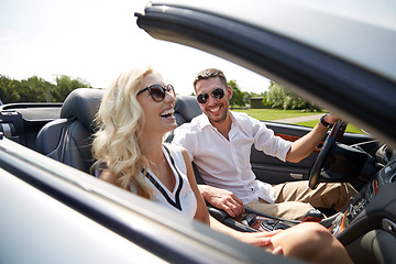 Image showing happy man and woman driving in cabriolet car